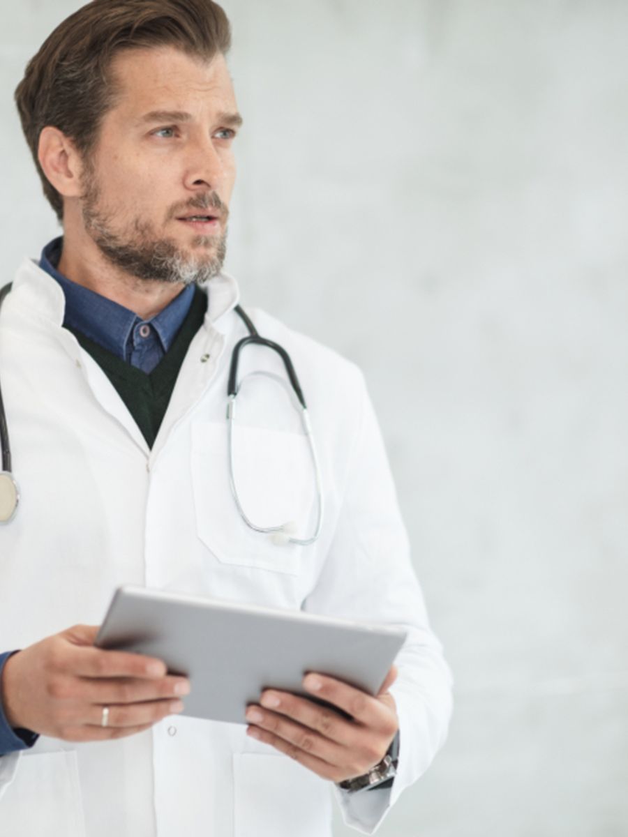 A healthcare professional with a tablet